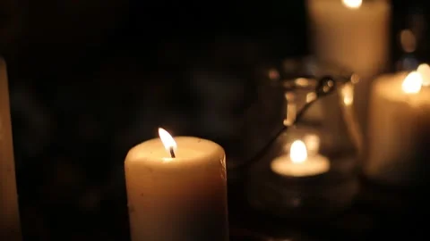 Candles in the dark and focus on front candle Stock Footage 147904692