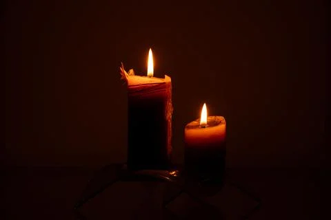 Candles in the dark close-up on a dark background Stock-Fotos