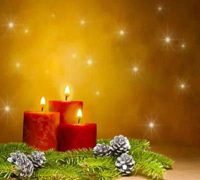 Candles decorated branches of a pine tree and fir cones Stock Photos