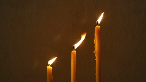 Candles flame on concrete wall Background. Stock Footage 148130073
