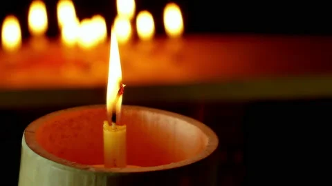Candles flame on dark Background. Video stock 148129583