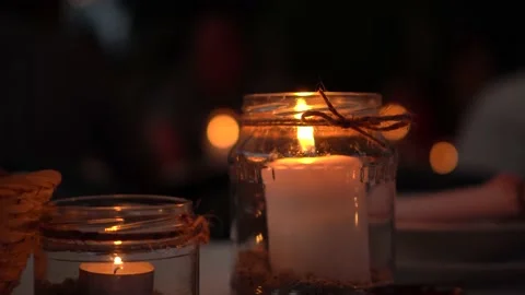 Candles flame as part of a table decoration Video stock 232757416