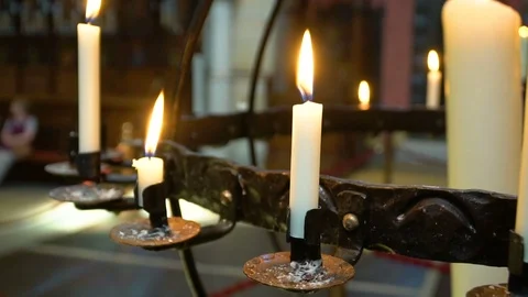 Candles flaming in candlestick Stock Footage 76358498