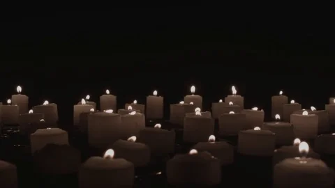 Candles Flickering in Long Horizontal Tracking Shot Stock Footage 79467474