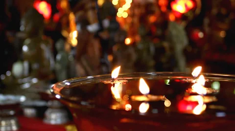 Candles float in waterbowl in Buddhist temple Stock Footage 34281029