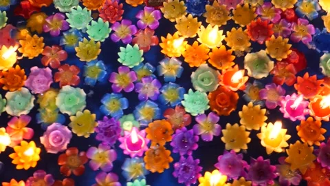 Candles floating on water in temple Stock Footage 295956809