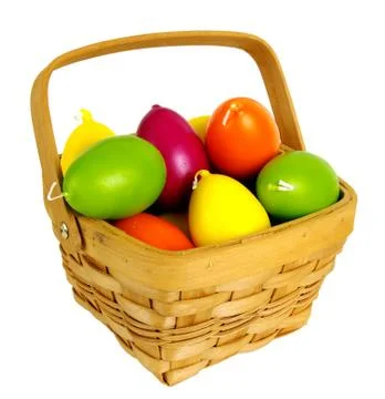 Candles in the form of easter eggs. Beautiful ornaments by a holiday. Stock Photos