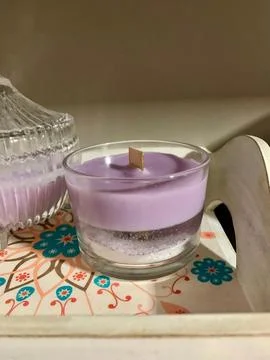 Candles in glass on a tray Stock Photos