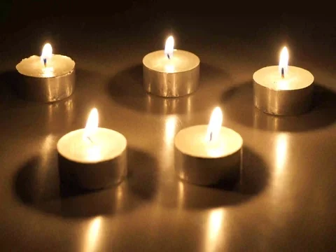 Candles glow for a full minute, then are extinguished Stock Footage