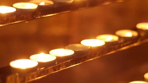 Candles on a gold background Stock Footage 74636670
