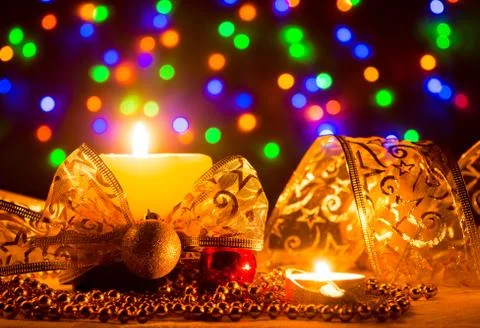 Candles with a golden ribbon and balloons Stock Photos