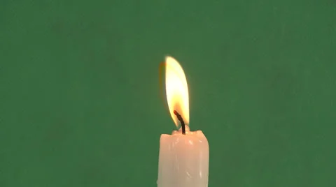 Candles on a green background Video stock 37345454
