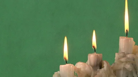 Candles on a green background Video stock 37345635