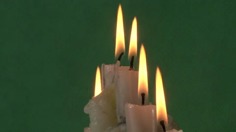 Candles on a green background Video stock 37345685