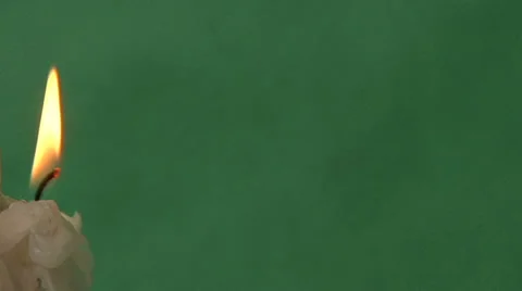 Candles on a green background Video stock 37345769