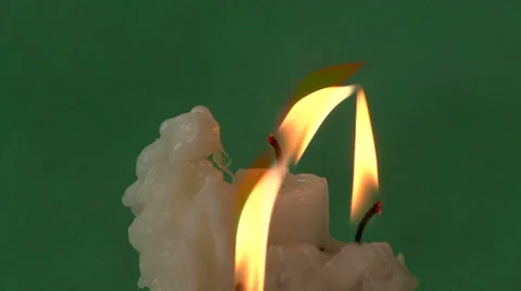 Candles on a green background Video stock 37345831