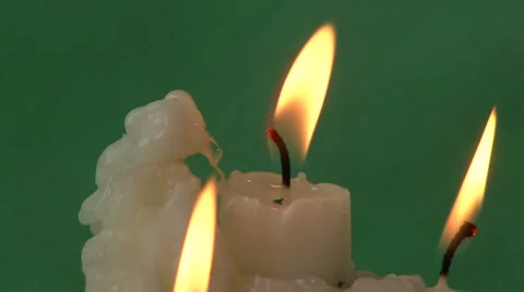 Candles on a green background Video stock 37345845