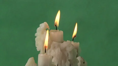 Candles on a green background Video stock 37345898