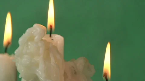 Candles on a green background Video stock 37345958