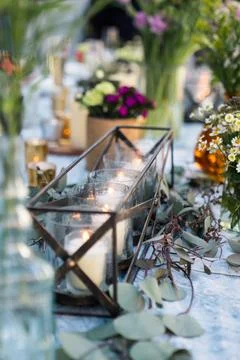 Candles in holder on table for rustic wedding decorations Stock Photos