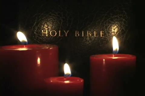 Candles infront of Bible Stock Footage 9855866