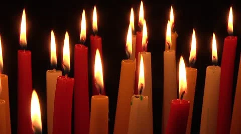 Candles isolated on black background. Candles Burning in the Darkness. Stock Footage