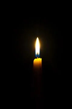 Candles isolated on black background Stock Photos