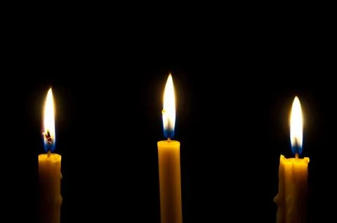 Candles isolated on black background Stock Photos
