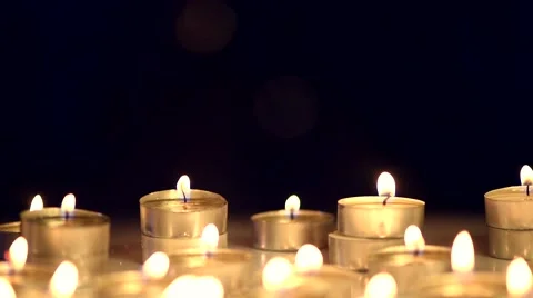 Candles light background. Candle flame at night. Holiday candles close up Stock Footage 50051813