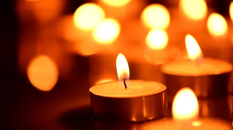 Candles light background. Candle flame at night. Abstract glowing background Stock Footage 50055826