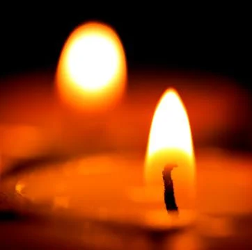 Candles light in darkness Stock Photos