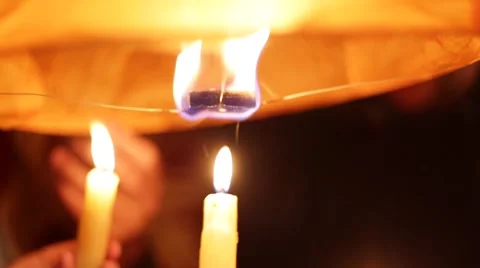 Candles lighting a Chinese Lantern Stock Footage 65641106
