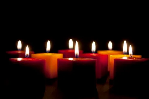 Candles lighting in the darkness Stock Photos