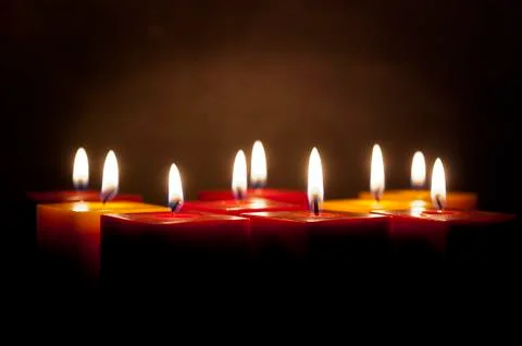 Candles lighting in the darkness Stock Photos