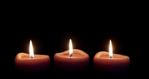 Candles lighting in the darkness Stock Photos