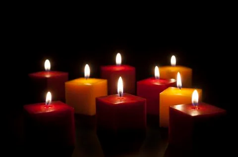 Candles lighting in the darkness Stock Photos