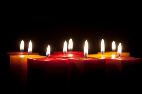 Candles lighting in the darkness Stock Photos