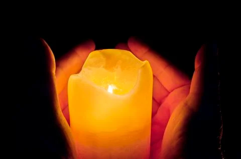 Candles lighting in the darkness Stock Photos