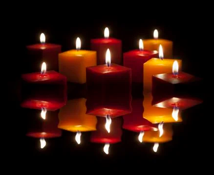 Candles lighting in the darkness Stock Photos