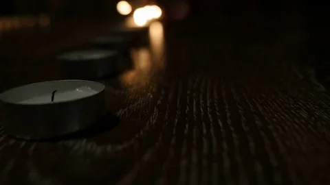 Candles lined up in a row. Lights up one after drugoy. Stock Footage 72246600