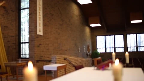 Candles lit at Easter with Alleluia Easter banner Stock Footage 230089687