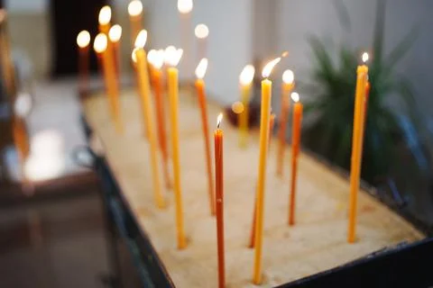 Candles lit in a peaceful setting for reflection Stock Photos