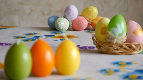 Candles made in shape of easter egg. Green, orange, yellow. Easter eggs candles Stock Footage 106146641