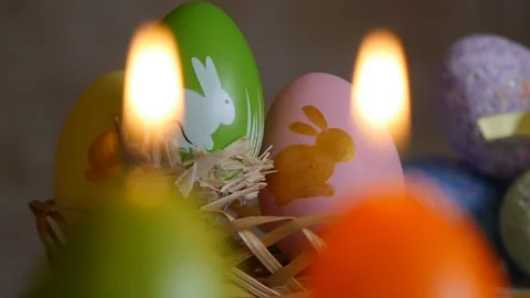 Candles made in shape of easter egg. Green, orange, yellow. Easter eggs candles Stock Footage 106147149