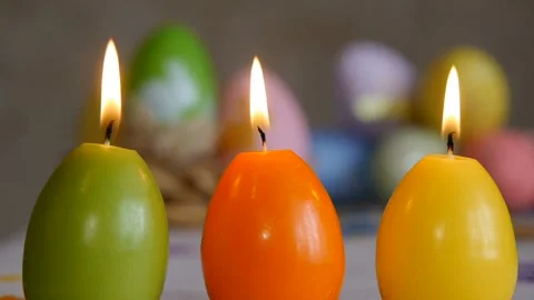 Candles made in shape of easter egg. Candles extinguished from the air.. Green Stock Footage 106147304