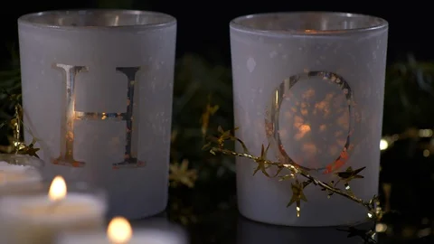 Candles Nested in Gold star Decoration Panning Right. Christmas 스톡 동영상 128749302