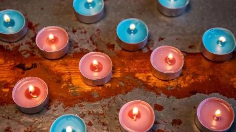 Candles on a rustic wooden table Stock Photos