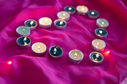 Candles in a shape of a heart Foto stock