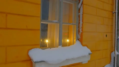 The candles in the snow-covered window. Stock Footage 148089668