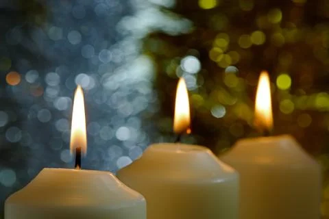 Candles with a sparkling tinsel background Stock Photos